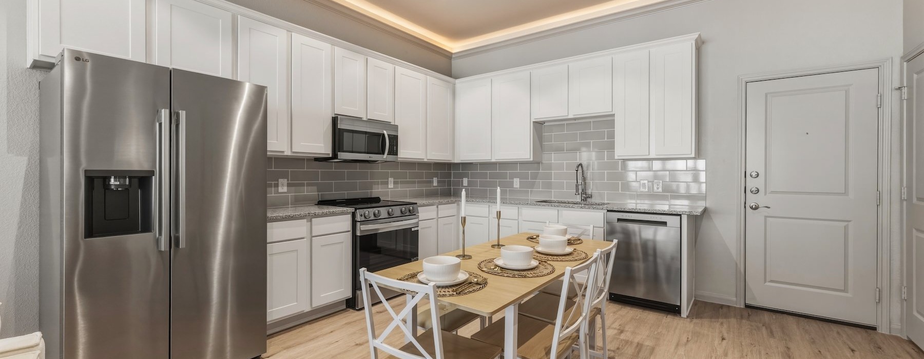 a kitchen with white cabinets