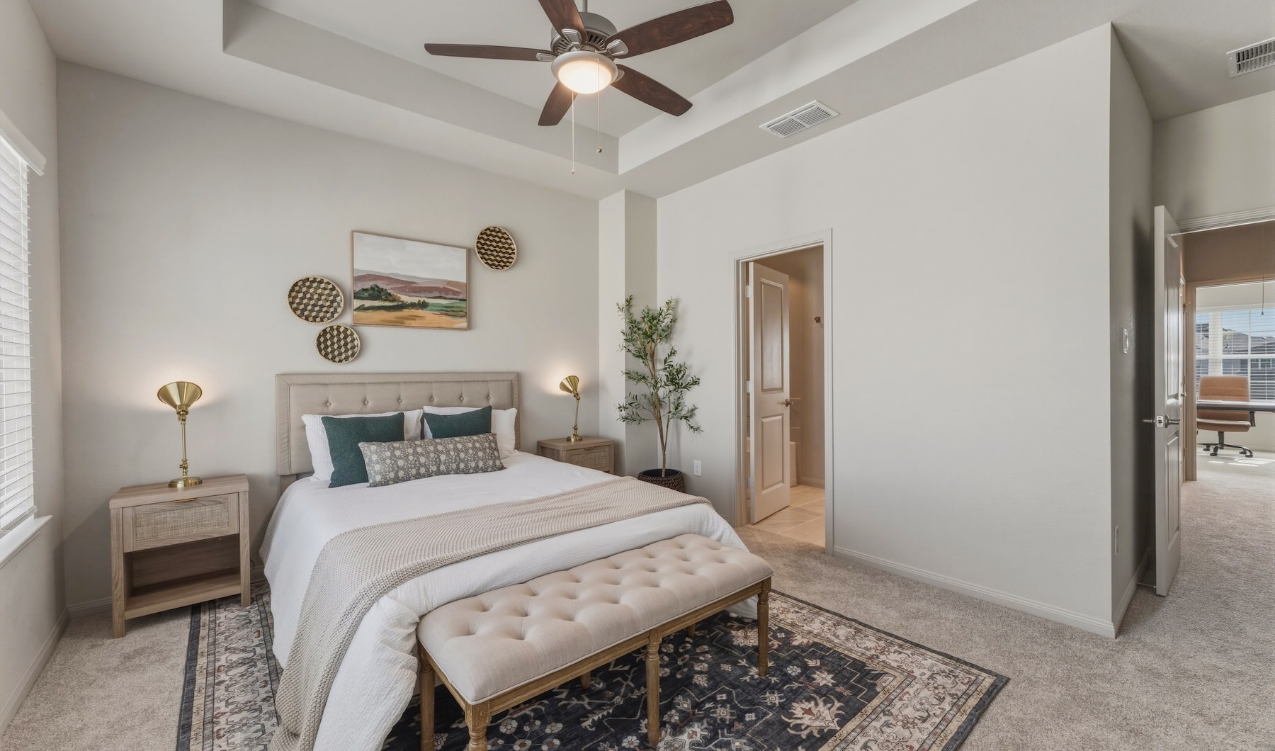 a bedroom with a bed and two nightstands